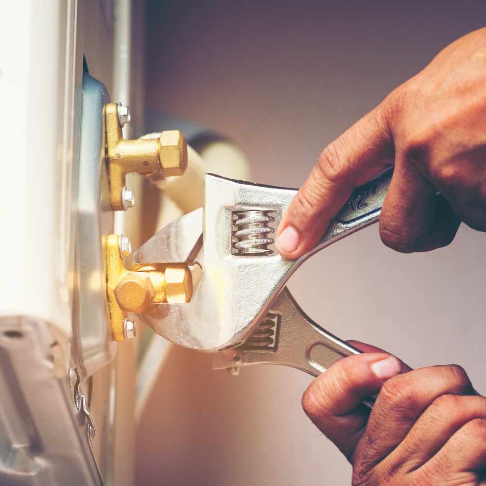 technician-hand-using-fix-wrench-to-tighten-outdoo-QQT7HWW.jpg